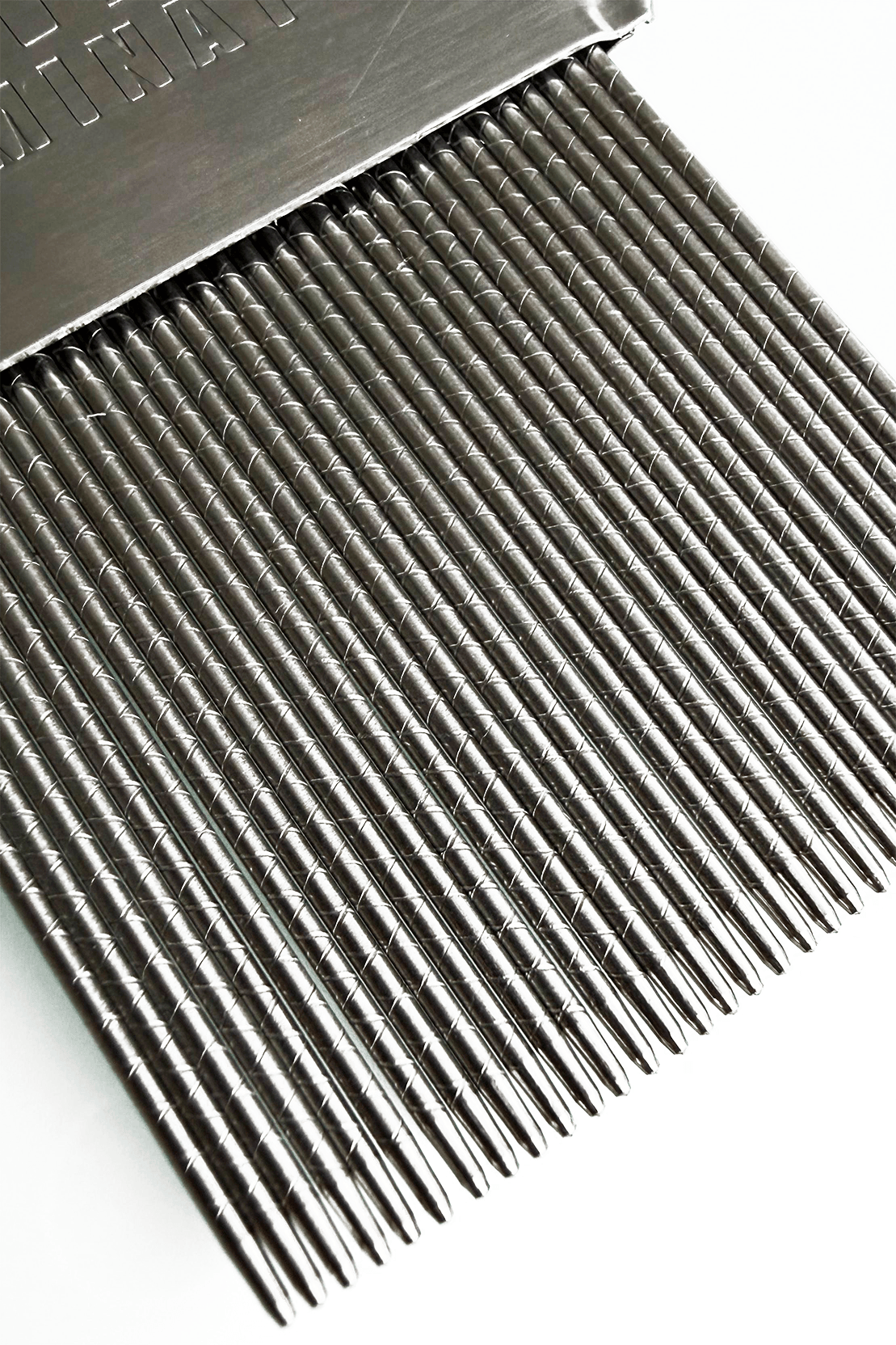 Micro-grooved stainless steel teeth of the Nit Free Terminator lice comb